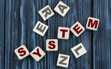 concept word SYSTEM on cubes on a beautiful gray blue background