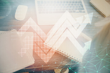 Fototapeta premium Blue arrow over woman's hands taking notes background. Concept of success. Double exposure