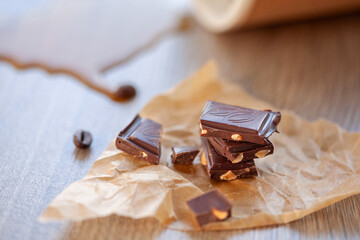chocolate slices close-up on the background of spilled coffee