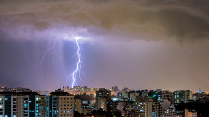 Images of the arrival of a strong summer storm with lightning and rain. Event in the city in the...