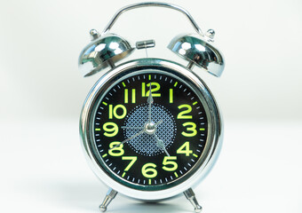 Shiny alarm clock isolated white background