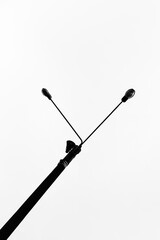 Stencil of a carved lamppost on a white background.