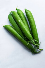 Pea pods on an isolated white background.