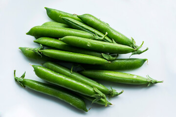 Pea pods on an isolated white background.