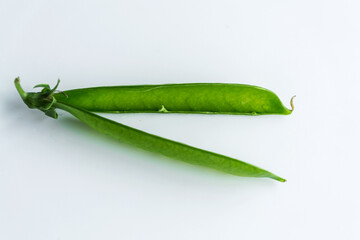 A single pea pod on an isolated white background.