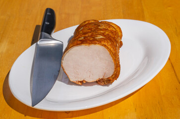 Smoked pork ham with paprika. Cold cuts on a white plate