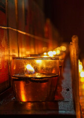 Lines of candle inside a temple