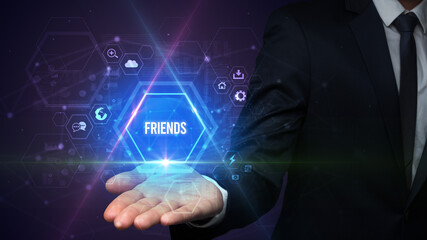 Man hand holding FRIENDS inscription, social media concept