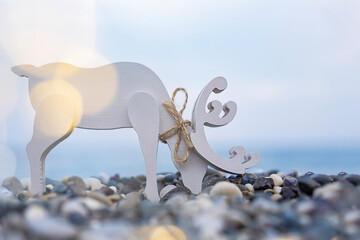 Reindeer christmas lights  on the beach .Christmas card . Time to travel and Christmas  consept....