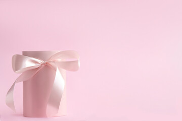 Empty, open pink gift box with a pink ribbon on pink background with copy space ,  valentine,Women's Day