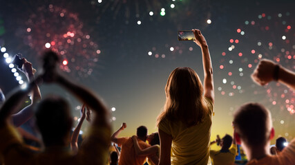 Fototapeta na wymiar Fans celebrate in Stadium Arena night fireworks
