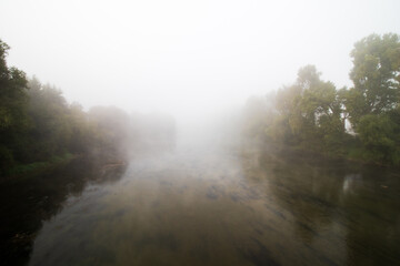 Fototapeta na wymiar misty morning over the river