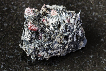 macro photography of sample of natural mineral from geological collection - unpolished red Garnet...