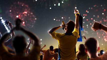 Fototapeta Fans celebrate in Stadium Arena night fireworks obraz