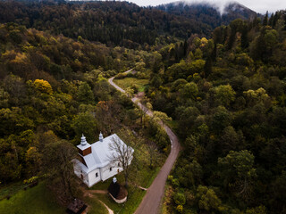 Old Church in Lopienka near Bieszczady Mountains. Autumn Colors. Drone View
