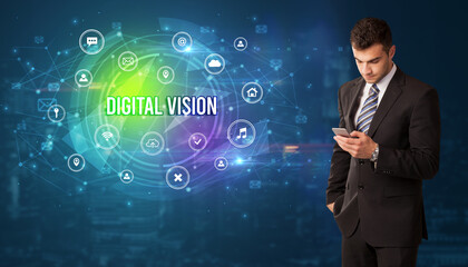 Businessman thinking in front of technology related icons and DIGITAL VISION inscription, modern technology concept