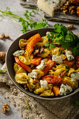 Homemade pasta with roasted pumpkin and blue cheese