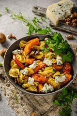 Homemade pasta with roasted pumpkin and blue cheese