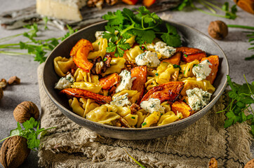 Homemade pasta with roasted pumpkin and blue cheese