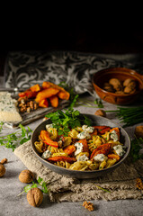 Homemade pasta with roasted pumpkin and blue cheese
