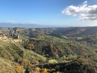 Fototapeta na wymiar Bagnoregio, Lazio, Italy (Civita di Bagnoregio). Panoramic views from the hilltop village on surrounding mountains and valleys. 