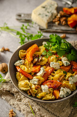 Homemade pasta with roasted pumpkin and blue cheese