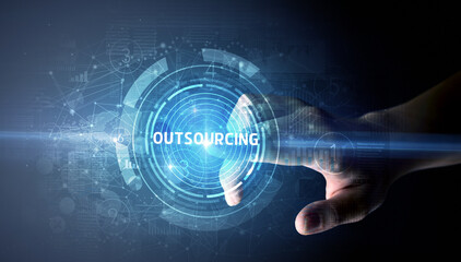 Hand touching OUTSOURCING button, modern business technology concept