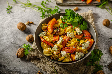 Homemade pasta with roasted pumpkin and blue cheese
