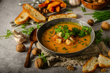 Pumpkin soup with herbs and crispy toast