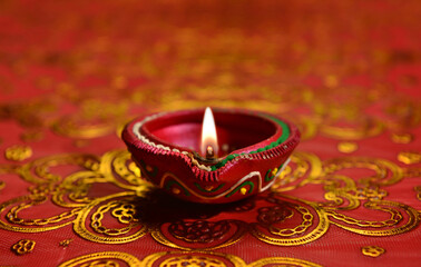 A decorative Diwali lamp against glittering background. Beautiful greeting card cover for 'Festival...