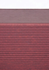 Fototapeta premium red roof tiles, building side view