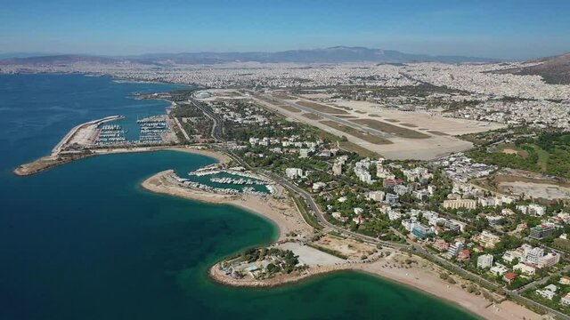 Aerial drone video of Marina of Agios Kosmas and abandoned former international airport of Athens in Elliniko area, South Athens riviera, Attica, Greece