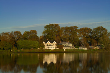 Fototapeta na wymiar Luxury Homes on a Lake - Argyle Lake Babylon NY