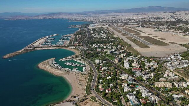 Aerial drone video of Marina of Agios Kosmas and abandoned former international airport of Athens in Elliniko area, South Athens riviera, Attica, Greece
