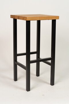 Metal bar chair with wooden seat