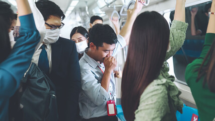 Sick man on train cough and make other people feel worry about virus spreading . Coronavirus COVID 19 pandemic and public transportation trouble concept .