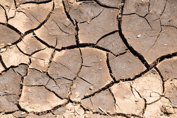 Part of a Huge Area of Dried Land Suffering from Drought - in Cracks
