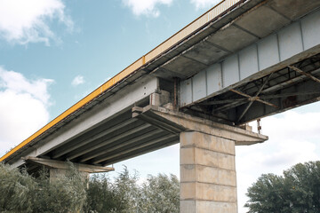 Fragment of metal train track bridge in the industrial area. bottom view.