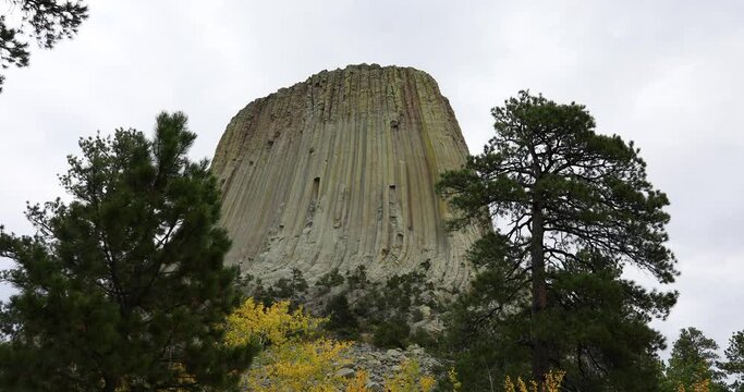 Devils Tower Wyoming mountain monument autumn 4K. Rock tower in Black Hills Wyoming. United States National Monument. Recreation, tourism, vacation, and rock climbing destination.