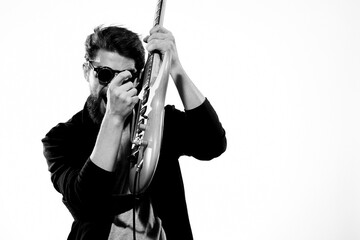 Man with guitar music performance entertainment contemporary performer sunglasses studio