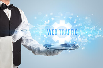Waiter serving new technology concept with WEB TRAFFIC inscription