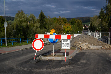 Roadworks and traffic closure. Road is closed because of construction. Traffic and roadsign with...