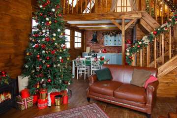 Christmas decorated kithen in loft style wooden chalet. Black, green and red colors. Modern loft...