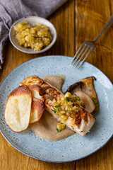 Pan fried halibut with mushroom velute, hazelnut pesto and potato crisps