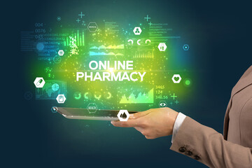 Close-up of a touchscreen with ONLINE PHARMACY inscription, medical concept
