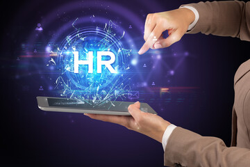 Close-up of a touchscreen with HR abbreviation, modern technology concept