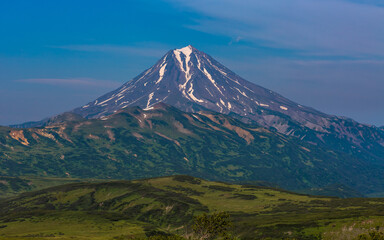 Fototapeta na wymiar Panoramic view of the volcano against the blue sky