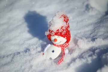 snowman lay in the snow