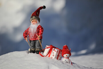 santa Claus and snowman with the gift