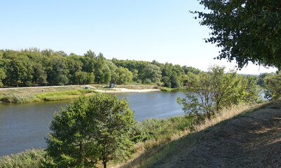 Fototapeta na wymiar Tsna river flowing in Tambov on a sunny summer day